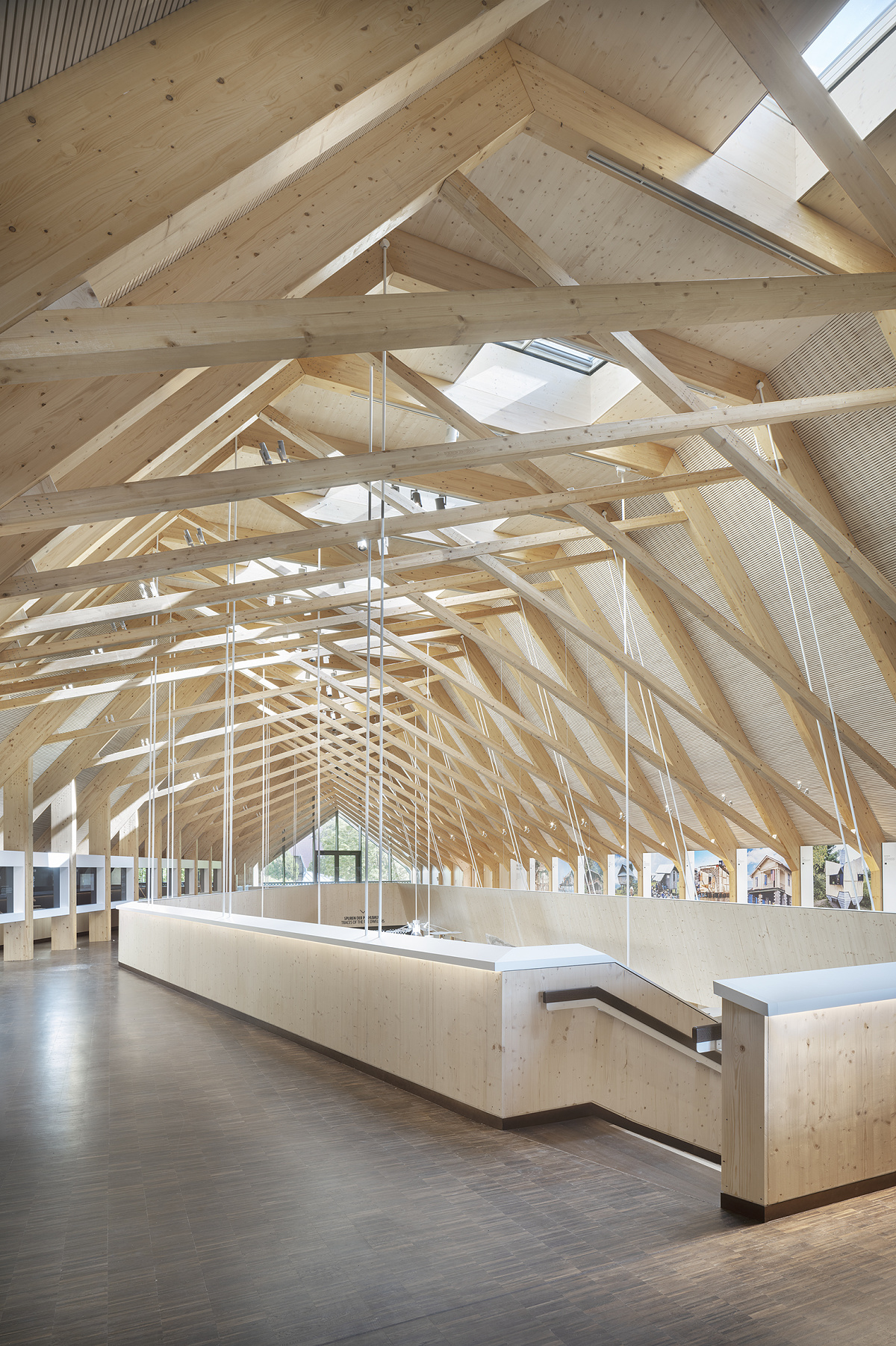 Pfahlbaumuseum Unteruhldingen interior featuring wooden structure and ERCO lighting.