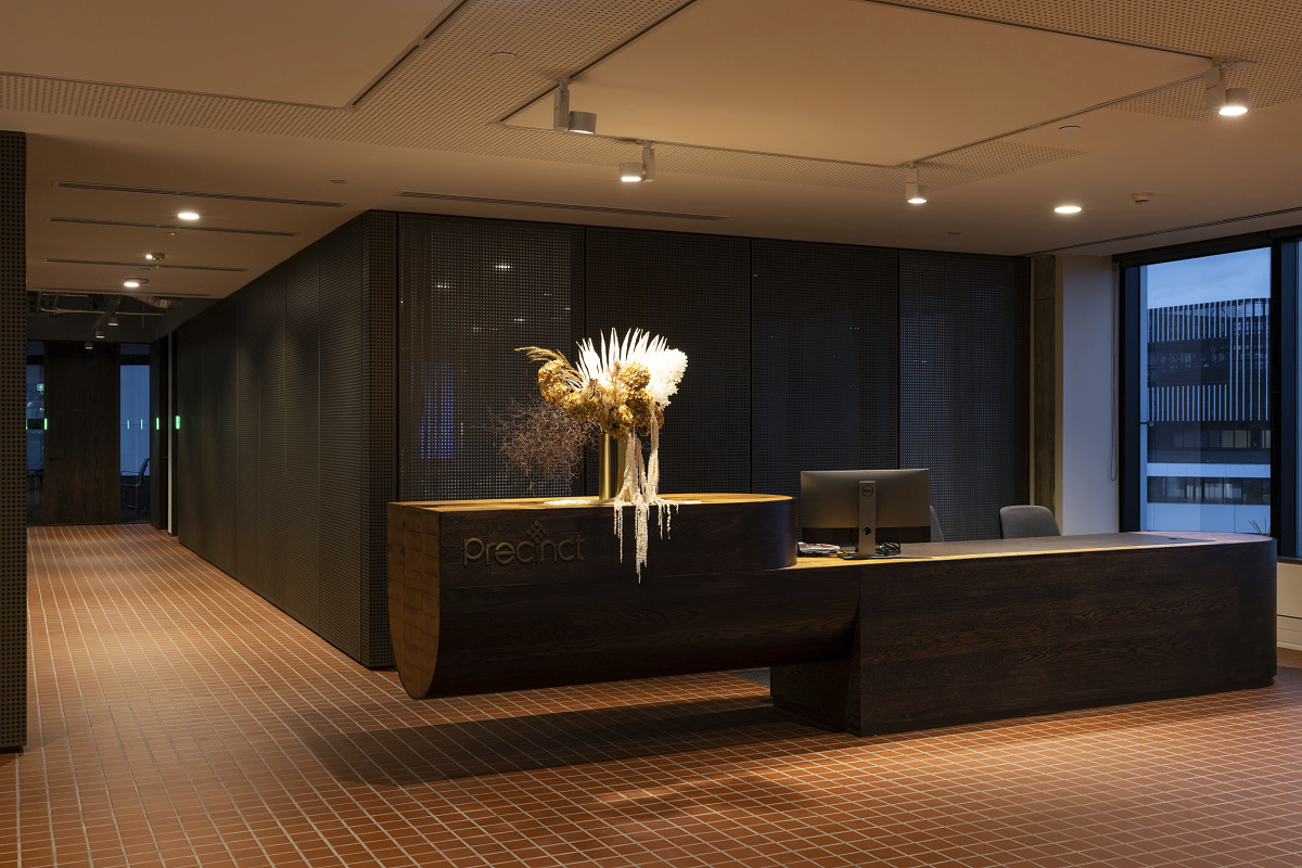 Precinct Properties reception area in Auckland, featuring ERCO lighting.