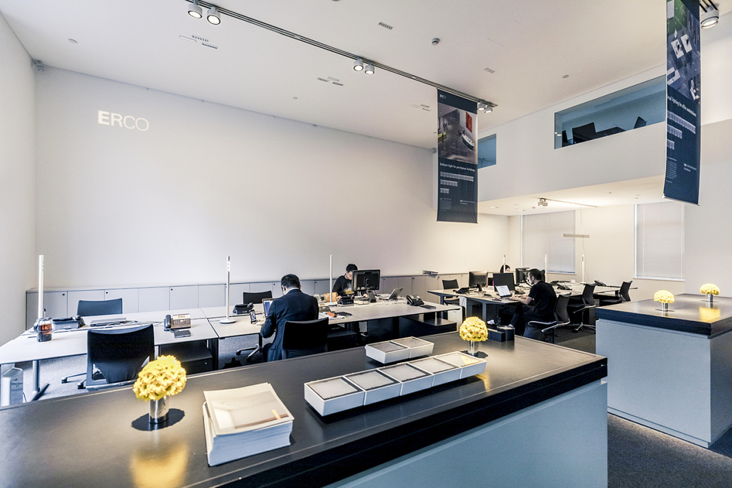 ERCO office space with employees working, showcasing lighting solutions.