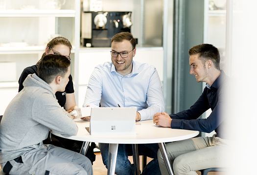 ERCO sales team collaborating on lighting design with architects and designers.