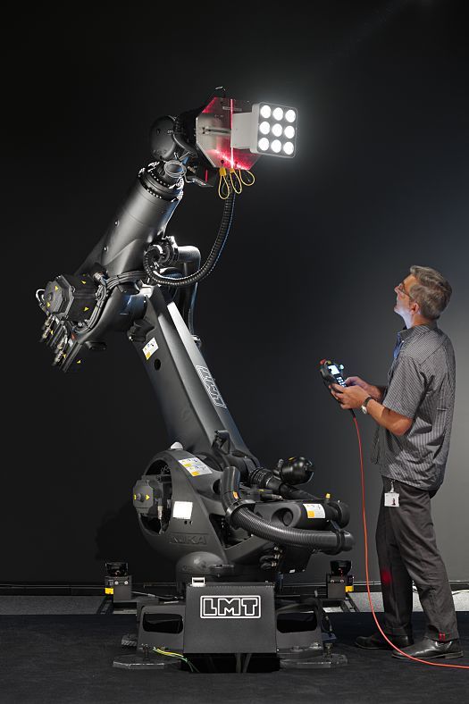 ERCO lighting robot in action, controlled by a professional, for precise lighting design.