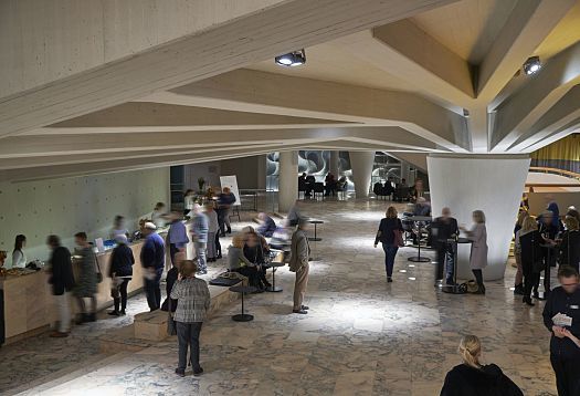 Schauspielhaus Düsseldorf foyer with ERCO LED lighting and visitors.