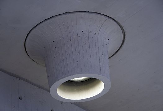 ERCO Kona projector, a custom lighting solution in a concrete volcano at Schauspielhaus Düsseldorf.