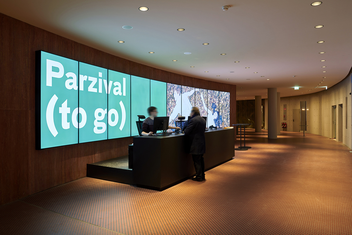 Schauspielhaus Düsseldorf foyer featuring ERCO LED lighting and 'Parzival (to go)' display.