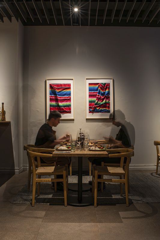 Restaurant Tizne in Gothenburg illuminated by ERCO Opton spotlights, creating a warm ambiance.