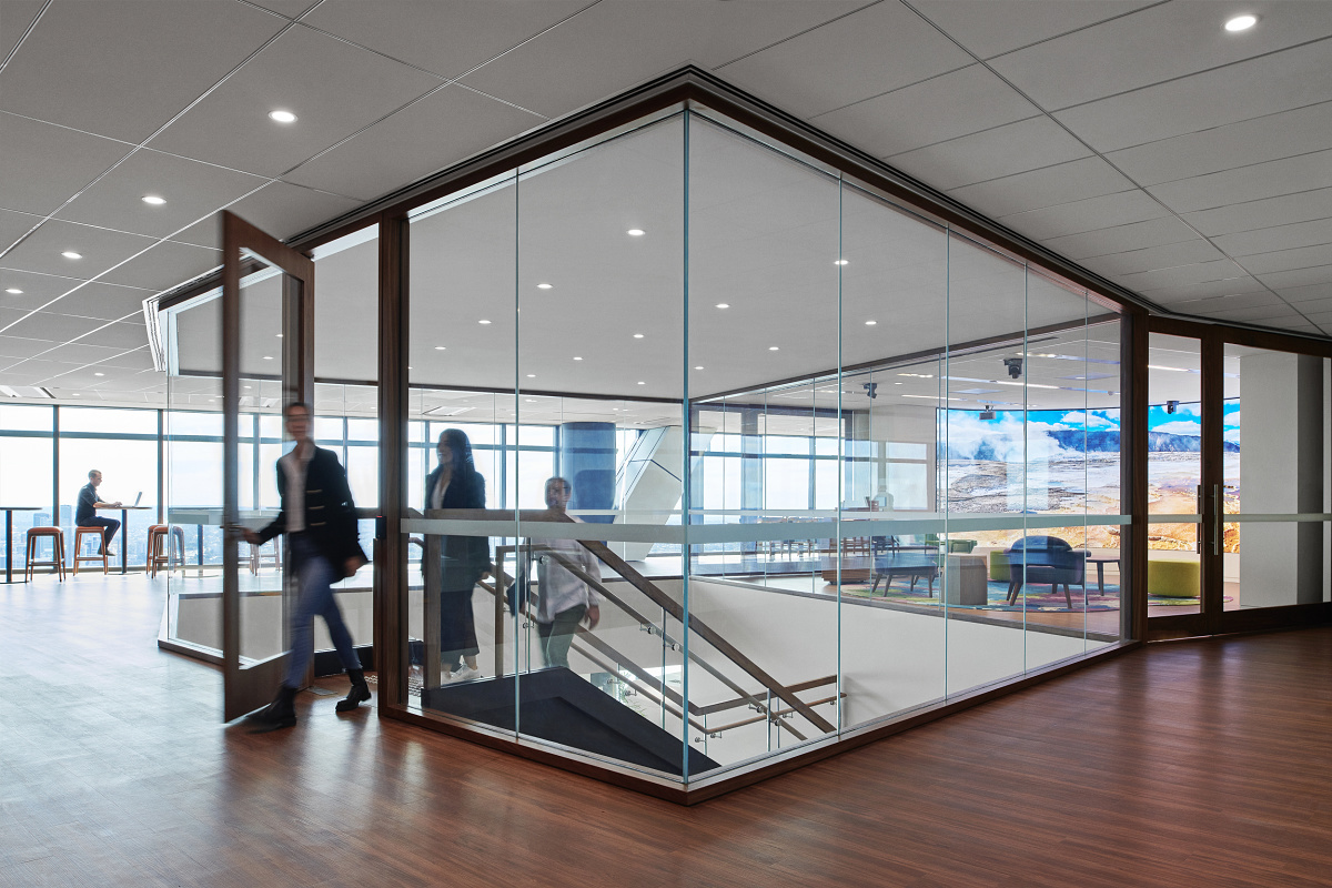 Interior of the SalesForce office in Sydney featuring glass walls and ERCO downlights.
