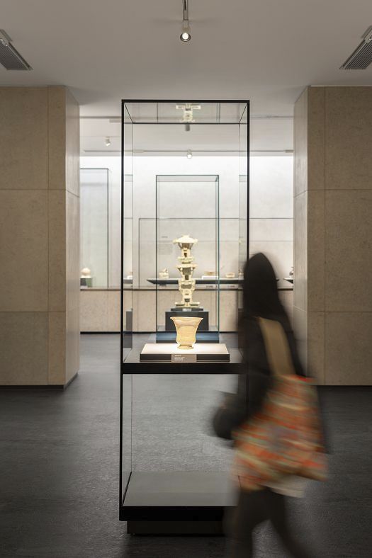 Illuminated ceramics in a display case at Shanghai Museum East, lit by ERCO spotlights.