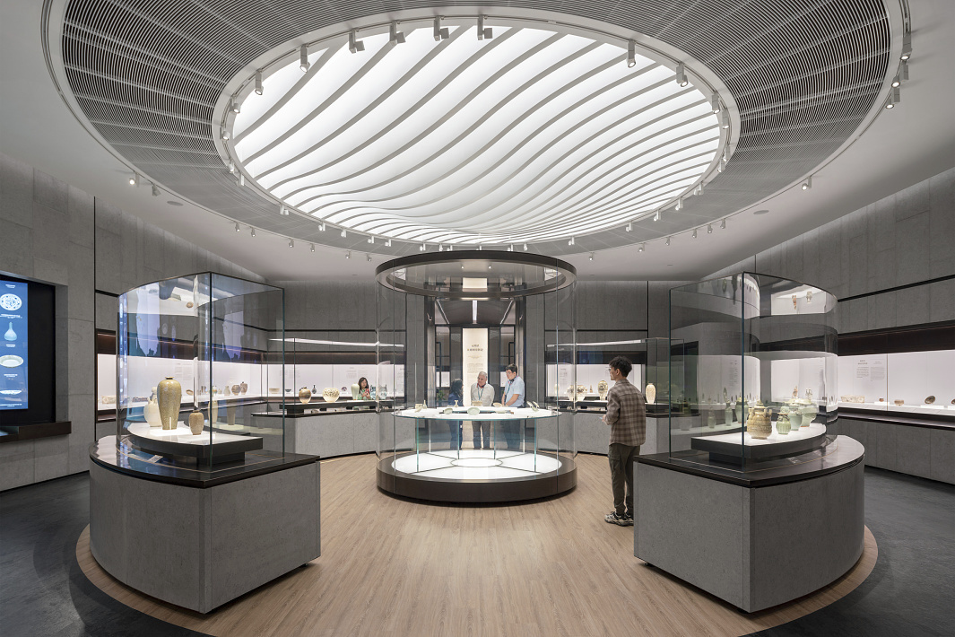 Shanghai Museum Easts Ceramics Gallery illuminated by ERCO LED lighting, highlighting porcelain exhibits.