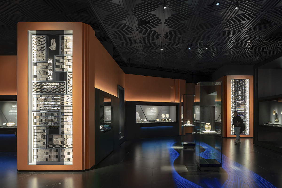 Shanghai Museum East's Bronze Gallery featuring ERCO LED lighting highlighting historical artifacts.