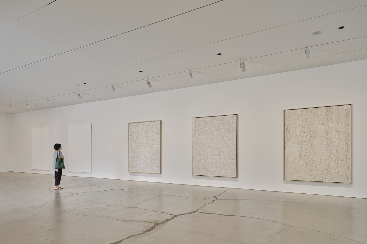 Visitor views art illuminated by ERCO Eclipse spotlights at Sorol Art Museum, Gangneung.