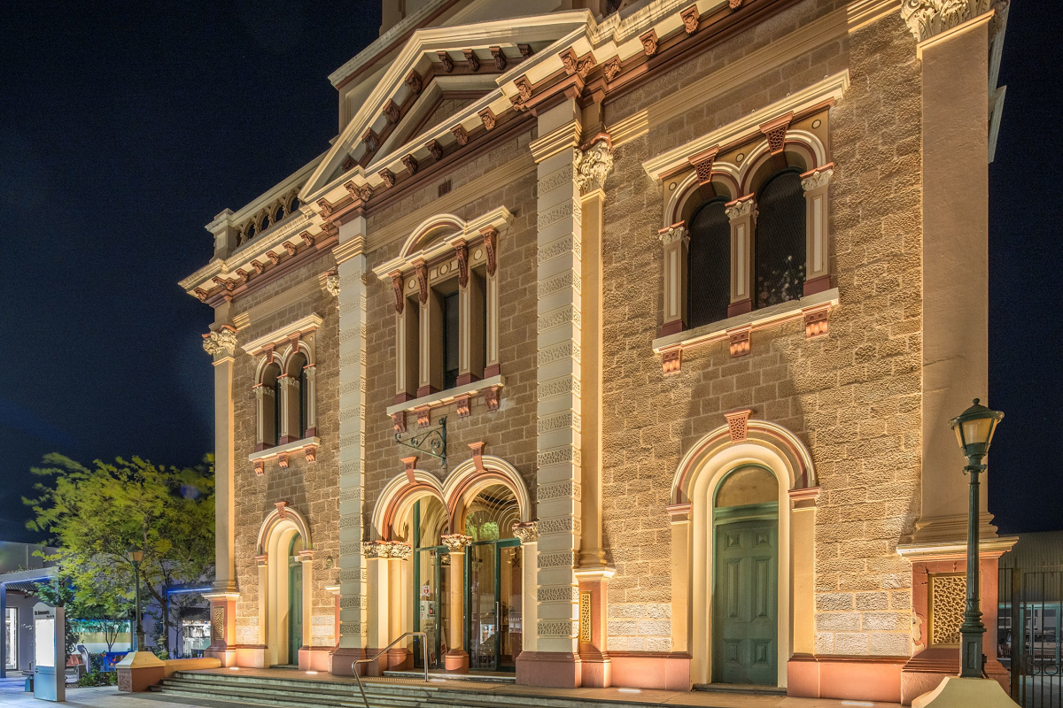 St Andrews Church façade illuminated at night with ERCO grazing light, enhancing textures.