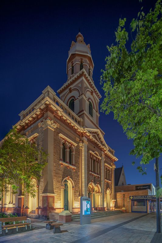 St Andrews Church façade illuminated at night with ERCO Site in-ground luminaires, emphasizing texture.