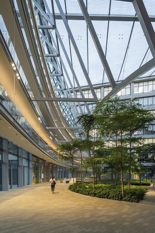 Surbana Jurong Campus, Singapore: Architecturally beautiful office building with ERCO LED lighting in a green garden landscape.
