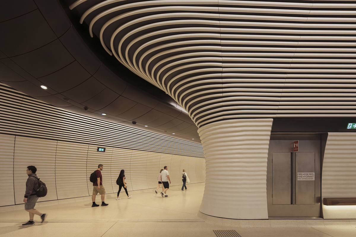 Gadigal Metro Station in Sydney, featuring sleek architecture and uniform lighting with ERCO downlights.