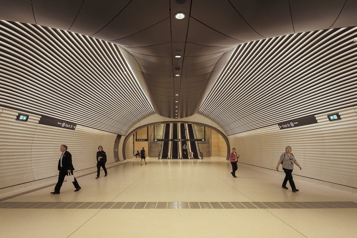 Gadigal Metro Station in Sydney, featuring uniform lighting with ERCO downlights in a modern design.