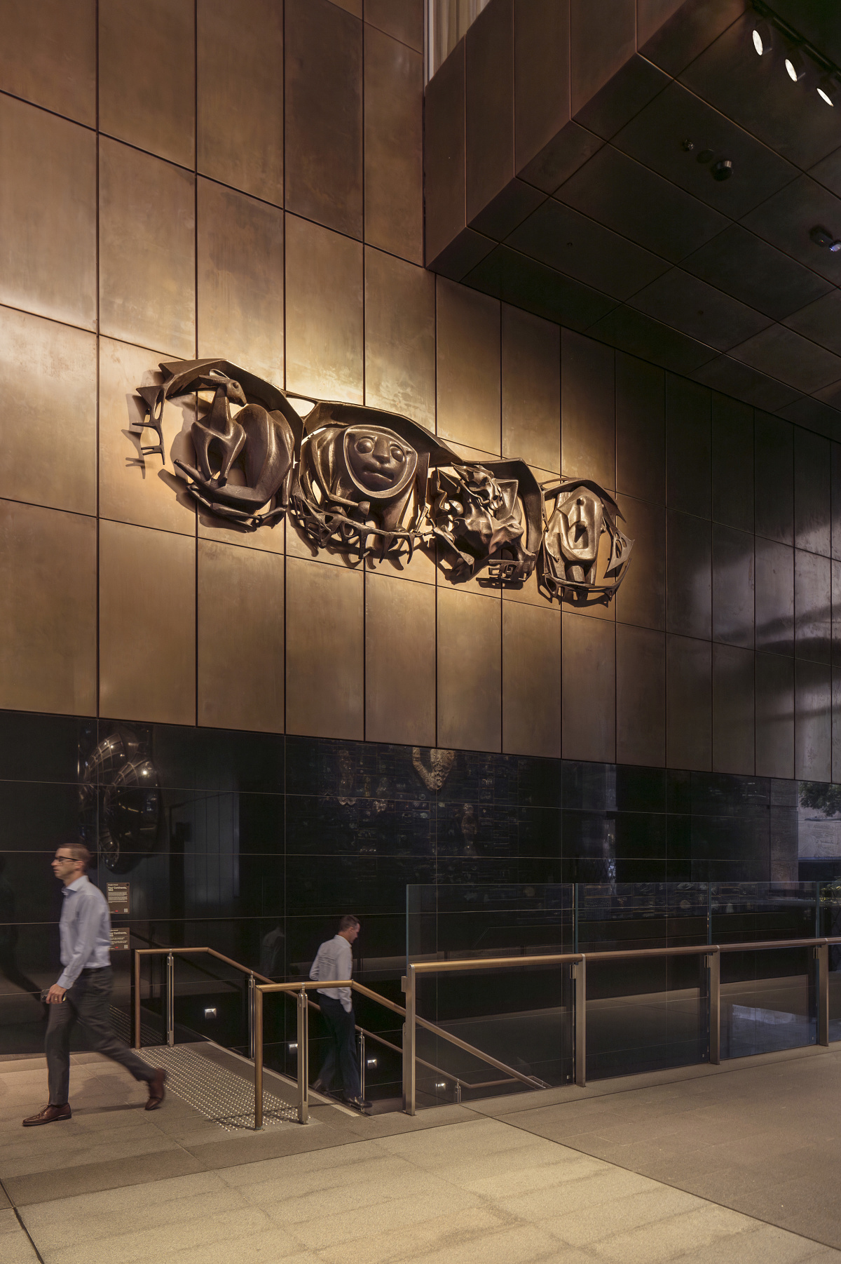 Douglas Annands Four Continents sculpture at Martin Place Metro, illuminated by ERCO spotlights.