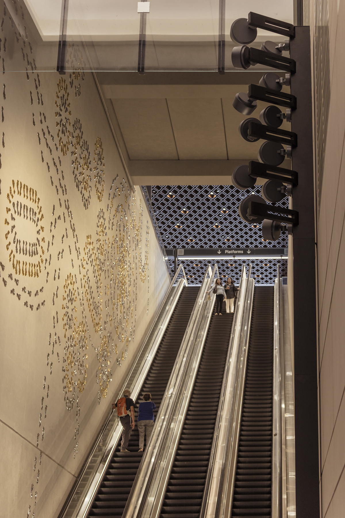ERCO Kona spotlights illuminate the escalator at Waterloo Metro Station, Sydney.