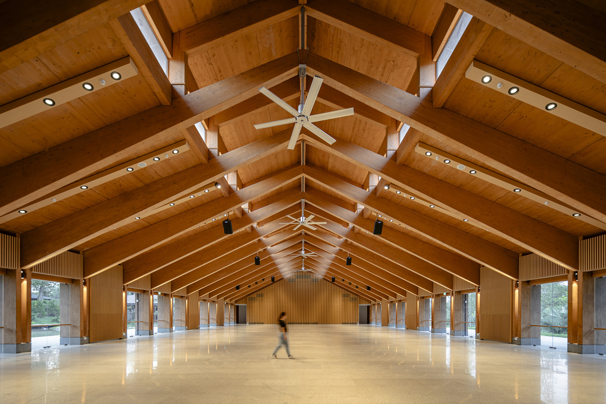The Guesthouse interior in Singapore, featuring ERCO LED lighting accentuating the timber structure.