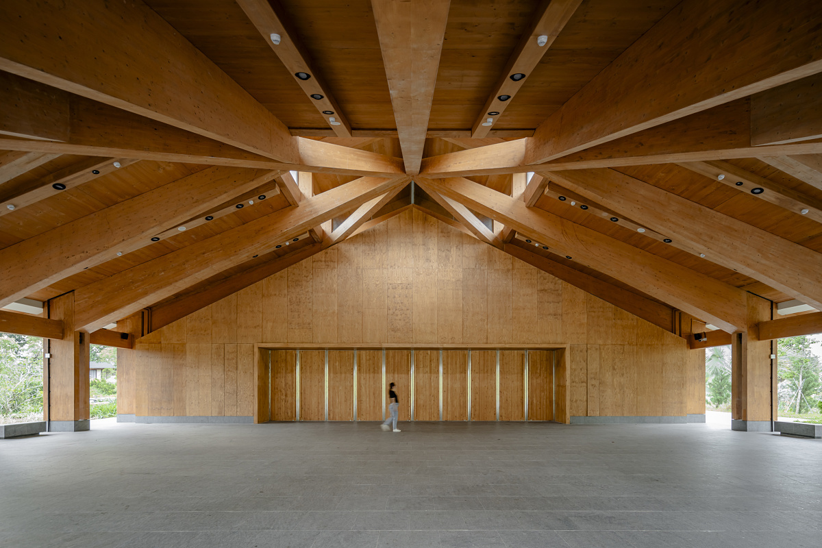 The Guesthouse Singapore interior featuring timber structure and ERCO LED lighting.