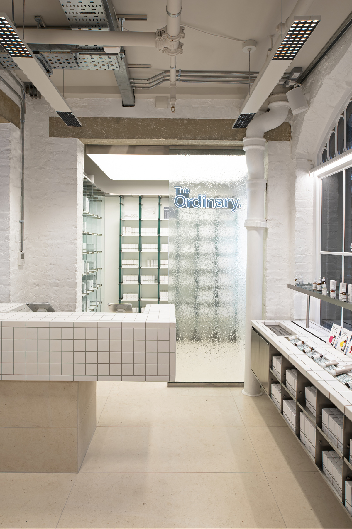 Interior of The Ordinary shop in Covent Garden, London, featuring ERCO LED lighting.