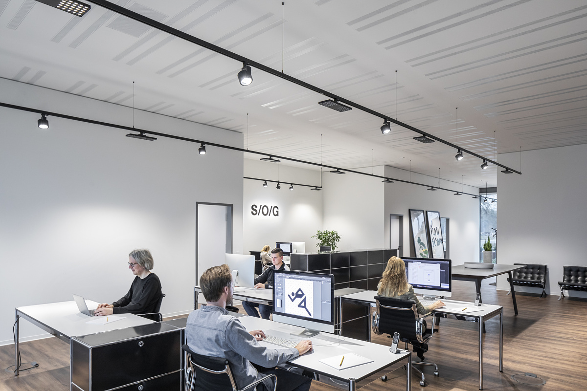 ERCO track lighting illuminates a flexible office space.