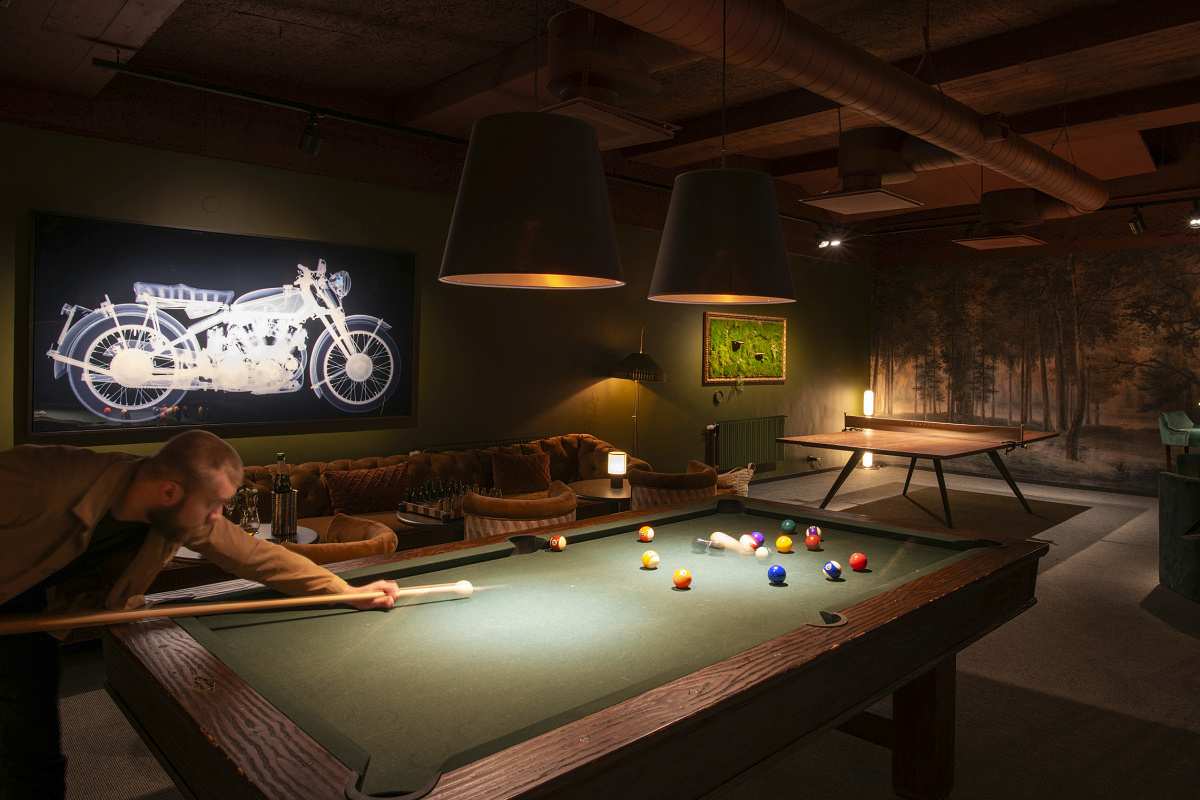 Atmospheric LED lighting at Hotel Villa Foresta highlighting a billiards game.