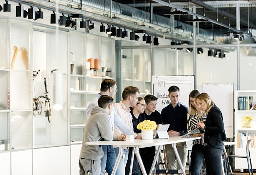 ERCO apprentices and students collaborate on a project in the office.