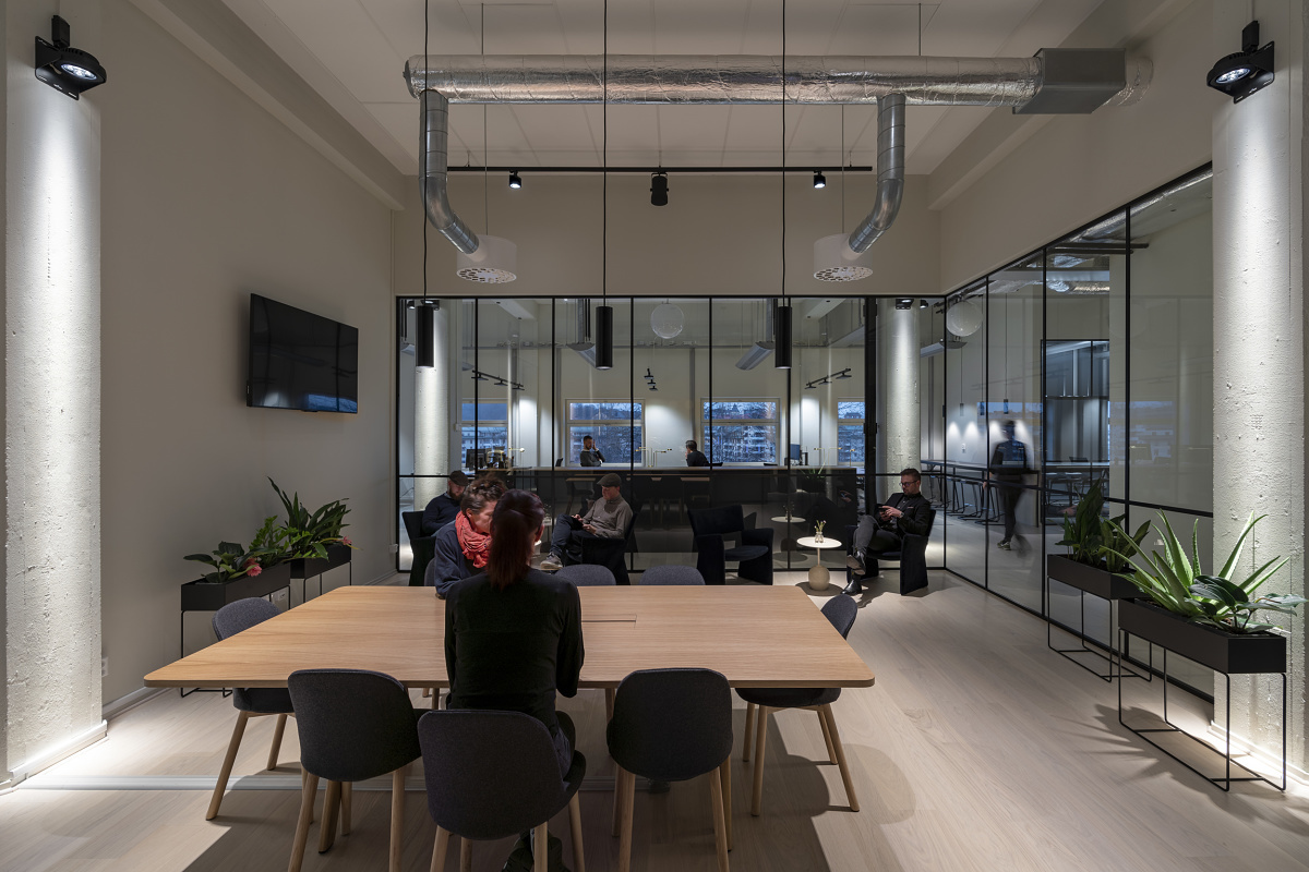 ERCO Casambi Bluetooth-enabled luminaires in a modern office, offering wireless lighting control.