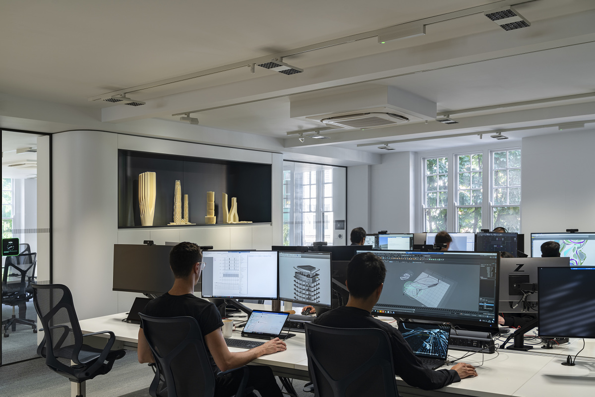 ERCO lighting at Zaha Hadid's London office supports modern, flexible, and collaborative work environments.