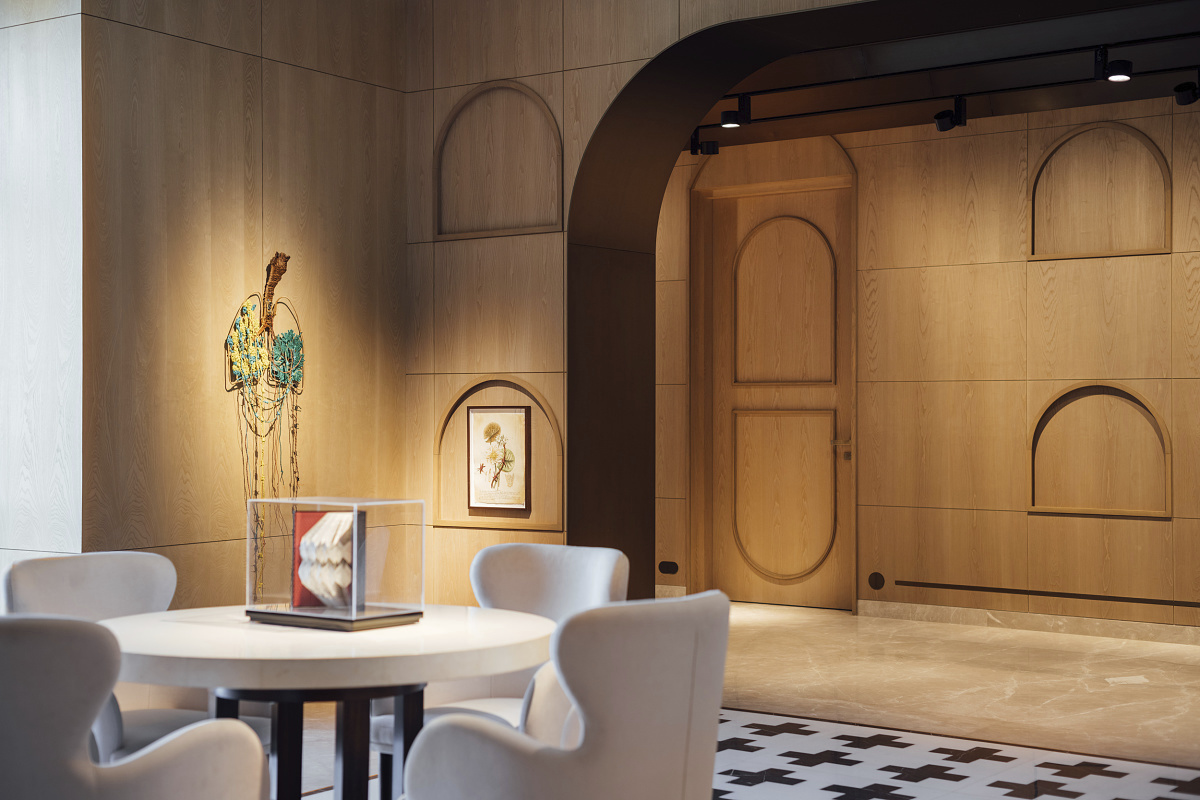 Zydus Cadila office lounge featuring Optec spotlights highlighting artwork, creating an inviting atmosphere.