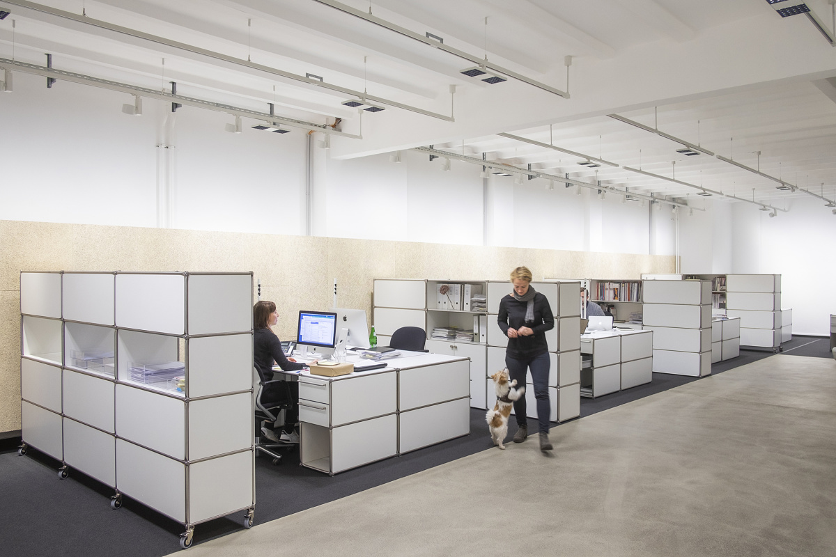 Modern office space with ERCO LED lighting, showcasing energy-efficient solutions after the T5/T8 ban.